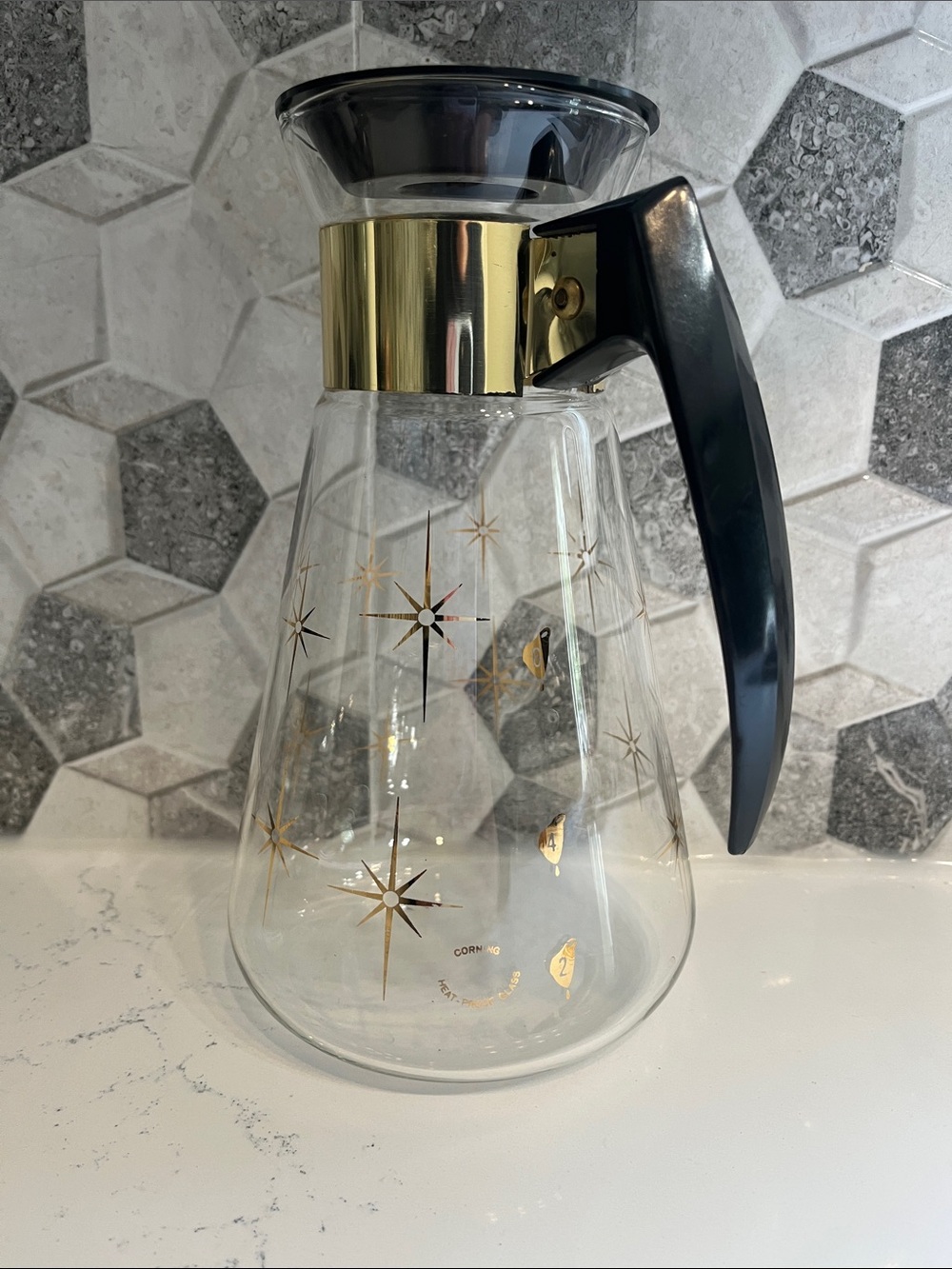 Vintage Corning Starburst Glass 6 cup Carafe with Black Handle and Gold Accents